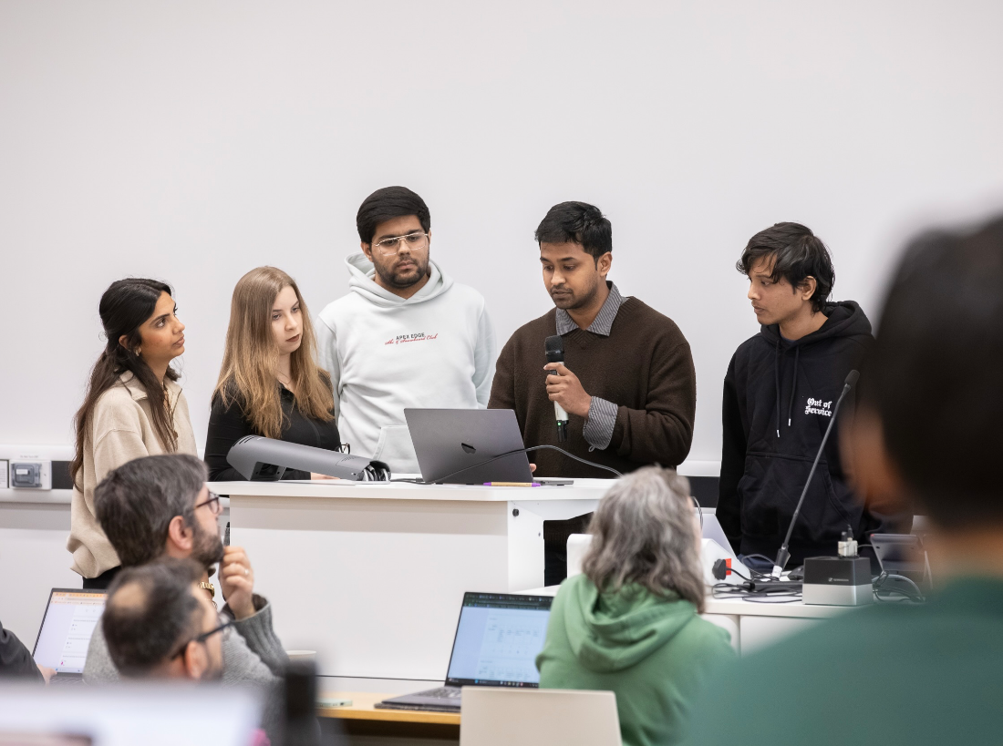 Team huddled around the laptop